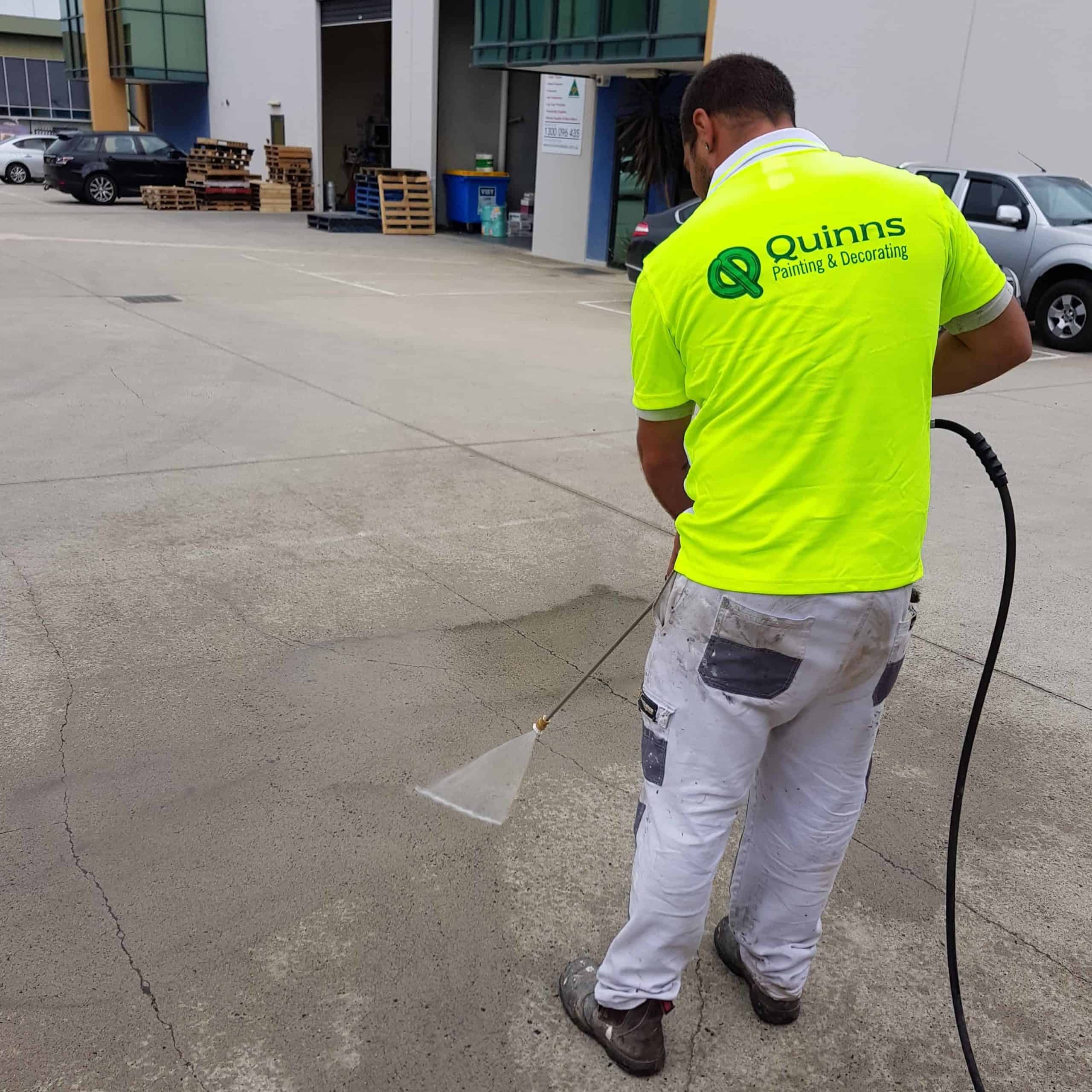 pressure washing the ground outside an industrial area