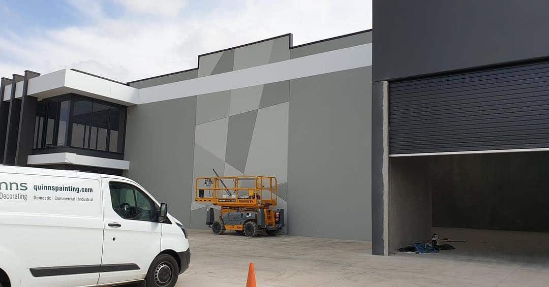 Quinns Painting Factory, with vehicles outside