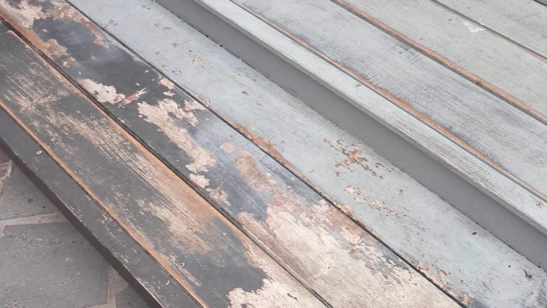timber deck with peeling paint