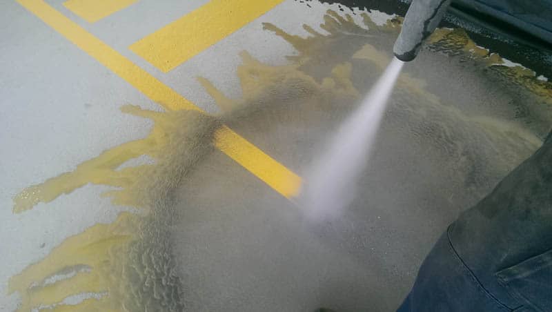 Removing yellow line marking from concrete with sandblasting
