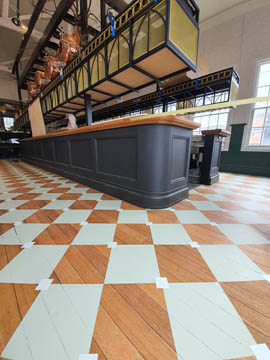 closeup of the checkers we painted on the floor of an old style pub