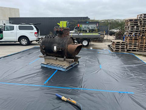 sandblasting an old navy engine back to a shiny exterior