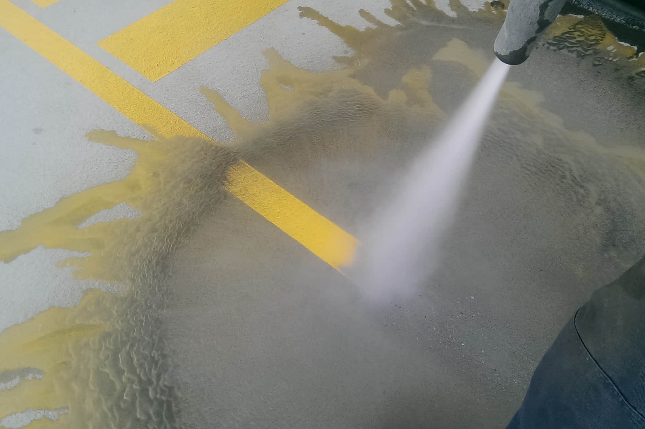 Removing yellow line marking from concrete with sandblasting - sandblasting cost blog